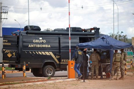 Security forces work as a robot of the federal police bomb squad is seen near what is believed to be an explosive artifact in Brasilia, Brazil, December 24, 2022. REUTERS/Adriano Machado